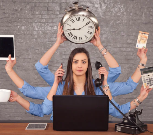 girl with 6 arms holding various things to symbolize busyness in the office