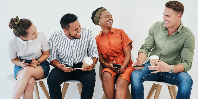 group-of-people-sitting-and-laughing-2048x1365